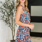 Meadow Mischief Sleeveless Romper in Navy/Orange/Teal